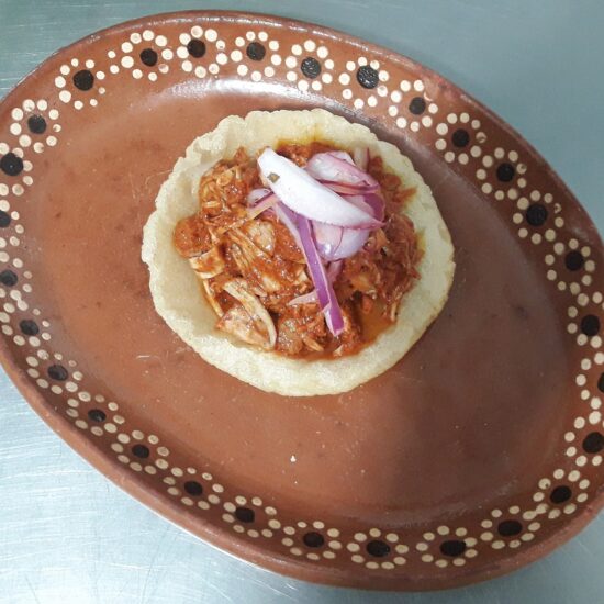 Cochinita pibil with pickled red onion