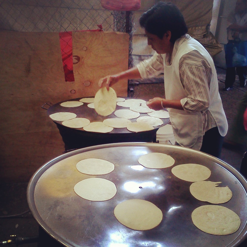 A handmade tortilla on a comal