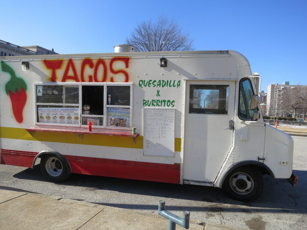 A taco truck parked on a city street